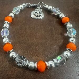 Vibrant Orange and Silver Beaded Bracelet with Pumpkin Charm